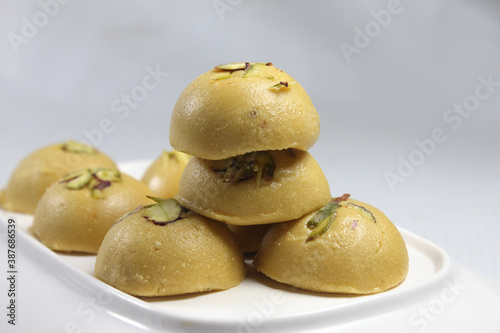 Besan ki Burfi or besan ke ladoo is Traditional Indian sweet made from  chickpea flour desi ghee and sugar during festival seasons.