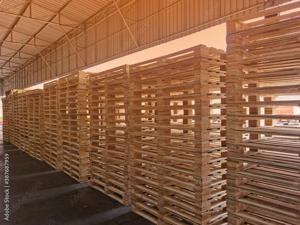 Wooden pallets stack in warehouse cargo storage, shipment in logistics and transportation industrial, wood pallets heap, delivery service Wooden pallets stack in warehouse cargo storage, shipment in logistics and transportation industrial, wood pallets heap, delivery service