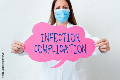 Handwriting text Infection Complication. Conceptual photo unwanted reaction resulted from an immunosuppression Laboratory technician featuring empty sticker paper accessories smartphone photo