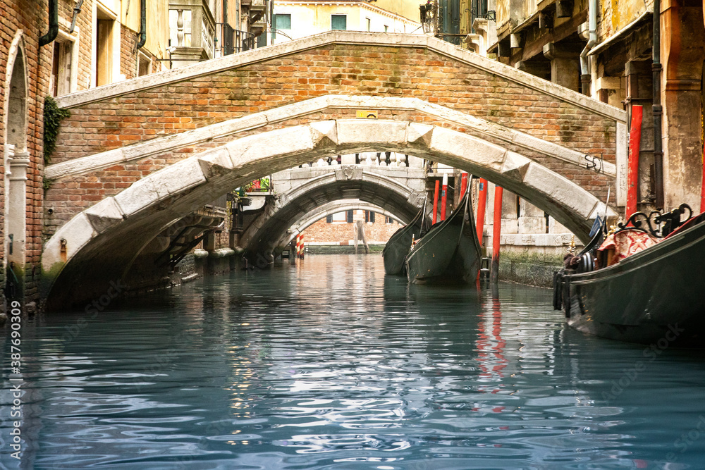 Bridge over canal in Venice Italy with gondolas