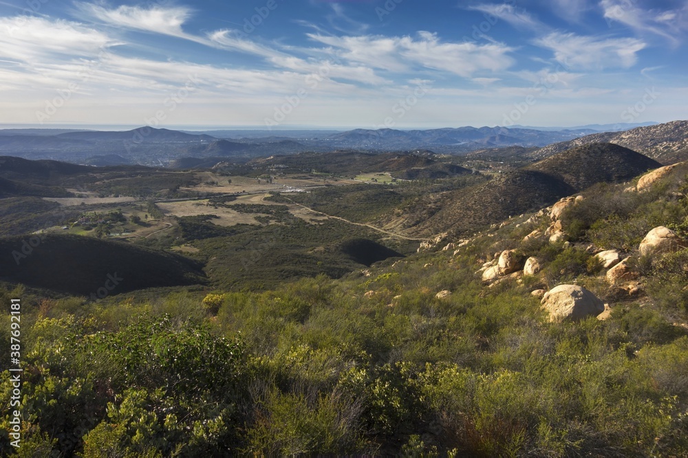 Scenic Landscape View of Rolling Hills and Distant Pacific Ocean on the horizon from Iron Mountain Hiking Trail in Poway, San Diego County North Inland, Southern California