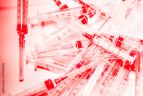 Many used syringes. Drug use, drug addiction concept. Deadly vaccine. Mass vaccination concept. Failed antivirus vaccine trials. Covid-19 cure trials concept.  Vaccine scientific research. 