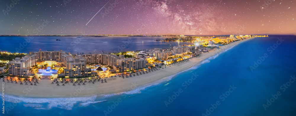 Cancun beach with milky way galaxy