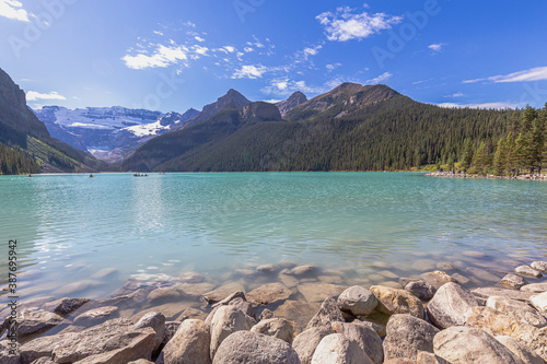 turquoise water surround with taiga forest and rocky mountain in summer morning at Lake Louise, Alberta Canada