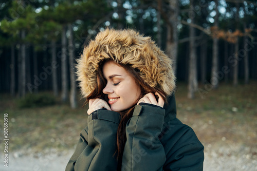 woman jackets eyes closed smile autumn forest nature