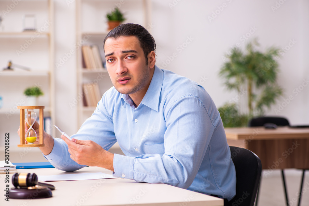 Young man in courthouse in divorcing concept Young man in courthouse in divorcing concept