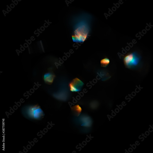 Abstract blurred color light spots. Lens, glass or crystals flare bokeh