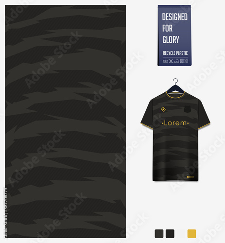 Fabric pattern design. Tiger stripe pattern on black background for soccer jersey, football kit or sports uniform. T-shirt mockup template. Abstract sport background.