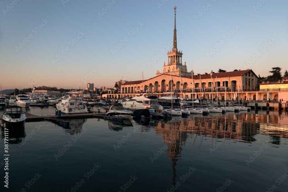 Seaport with mooring boats at sunset in Sochi, Russia