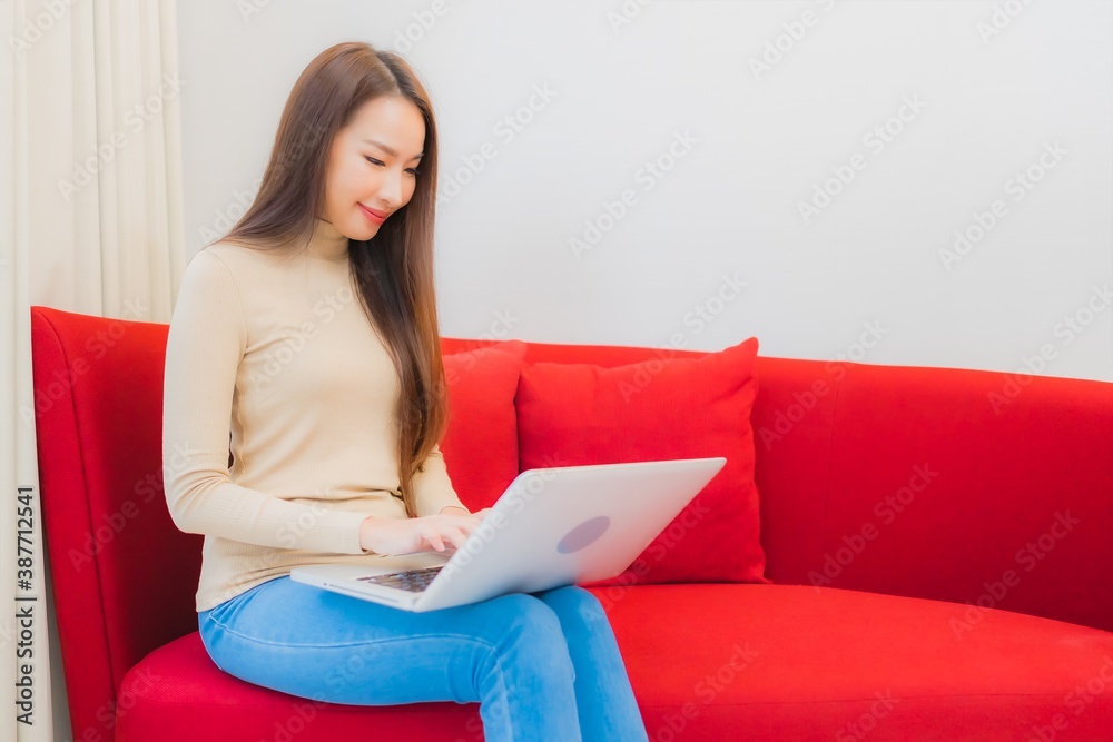 Portrait beautiful young asian woman use computer laptop on sofa Portrait beautiful young asian woman use computer laptop on sofa
