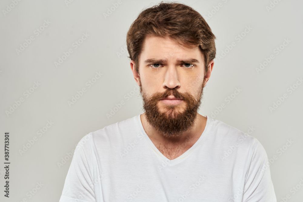 Bearded man gesturing with hand white cropped t-shirt studio lifestyle Bearded man gesturing with hand white cropped t-shirt studio lifestyle