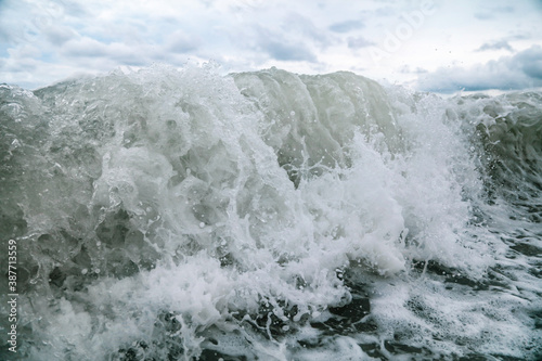 Wave in the sea with splashing water.