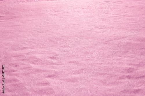 Winter background, pink snow, Christmas theme, snow texture with copy space