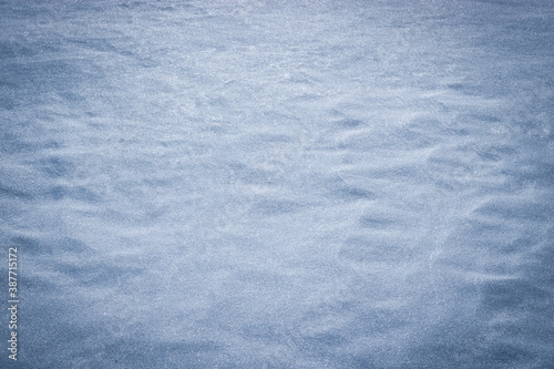 Winter christmas background, white snow texture with blue toning, copy space