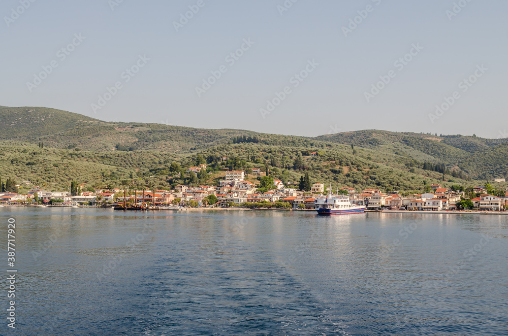 Evia island, Greece - June 28. 2020: Panorama approaching the island of Edipsos