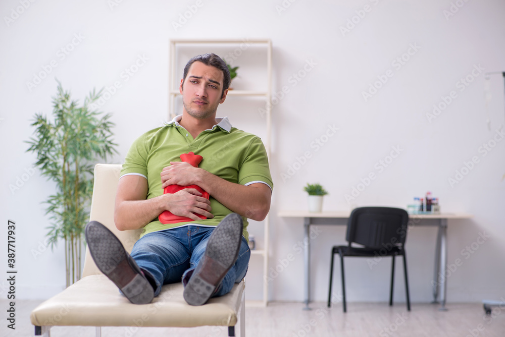Young man waiting for doctor in the clinic Young man waiting for doctor in the clinic