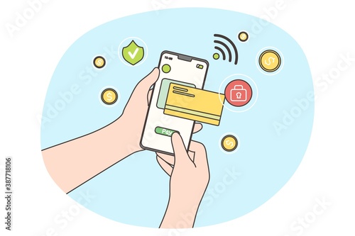 Online payment, technology, shopping concept. Paying transaction by credit card via electronic wallet wirelessly on banking application. Human hand holding mobile phone confirmating purchase remotely.