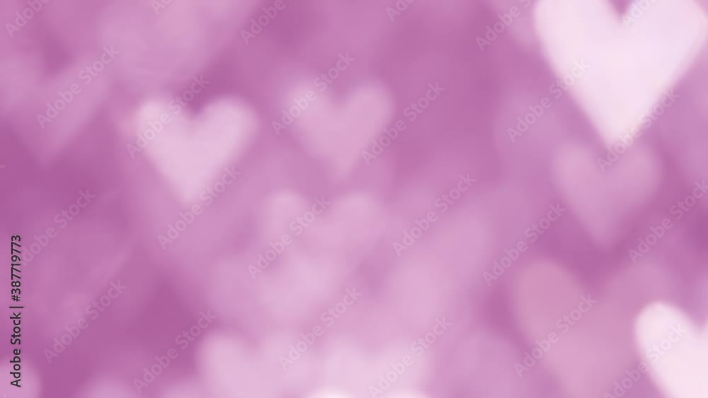 Glowing heart shaped lights sparkling on soft pink background. Romantic Valentine's day background. Glowing heart shaped lights sparkling on soft pink background. Romantic Valentine's day background.