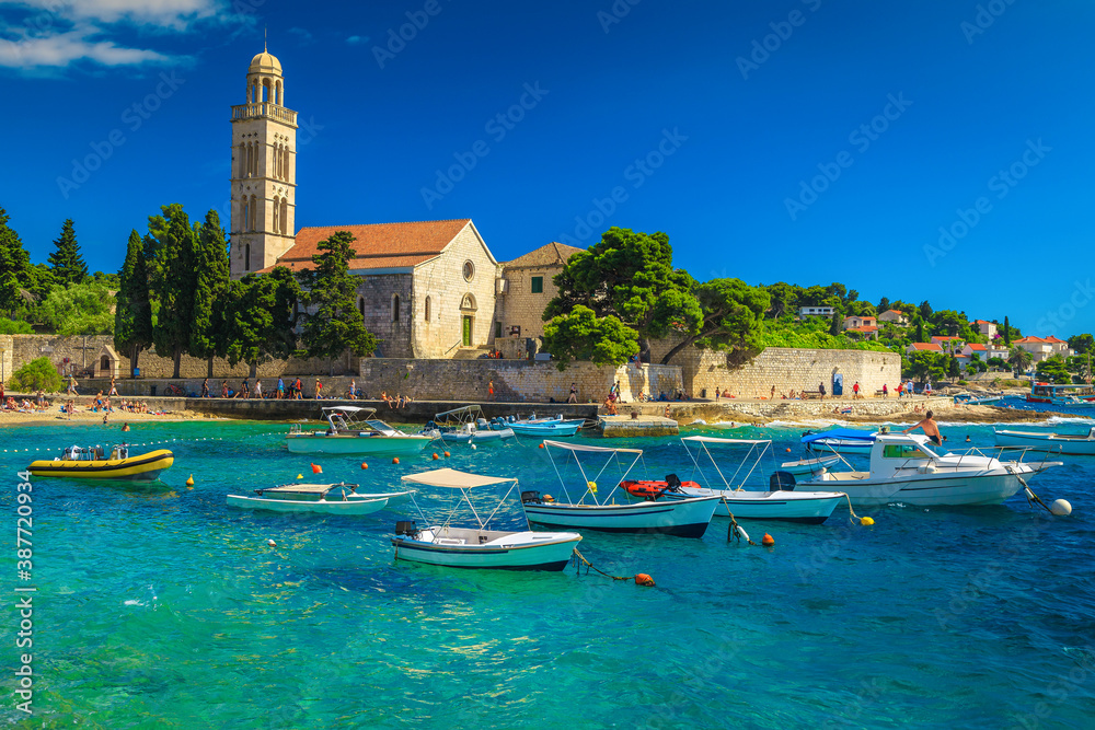 Harbor and waterfront promenade near medieval church, Hvar, Dalmatia, Croatia