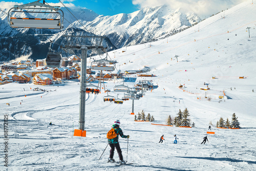 Obraz na plátně Skiers exercising on the slope and ski lifts, France, Europe