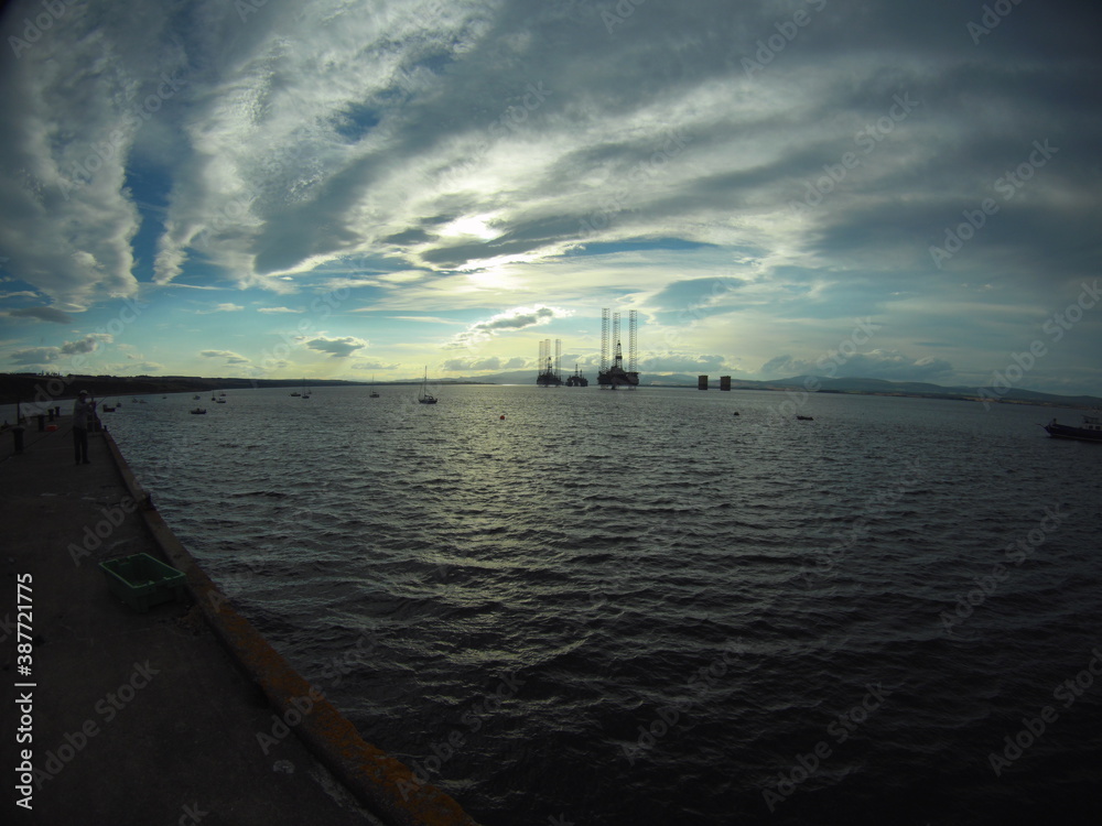 Oil Rig Platfrom. Silhouette of oil drilling rig on water. Oil Rig Platfrom. Silhouette of oil drilling rig on water.
