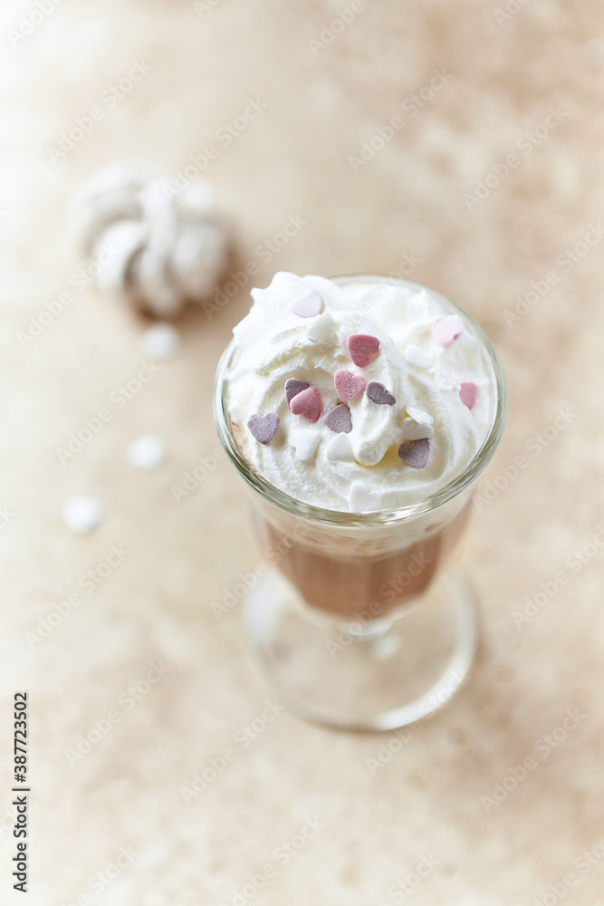 Coffee with whipped cream on bright stone background. Copy space. Coffee with whipped cream on bright stone background. Copy space.