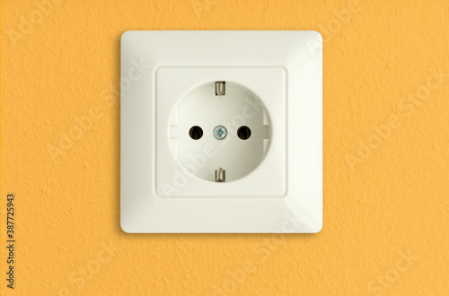  electrical socket on sunny yellow wall, solar power, electric power outlet, renewable energy