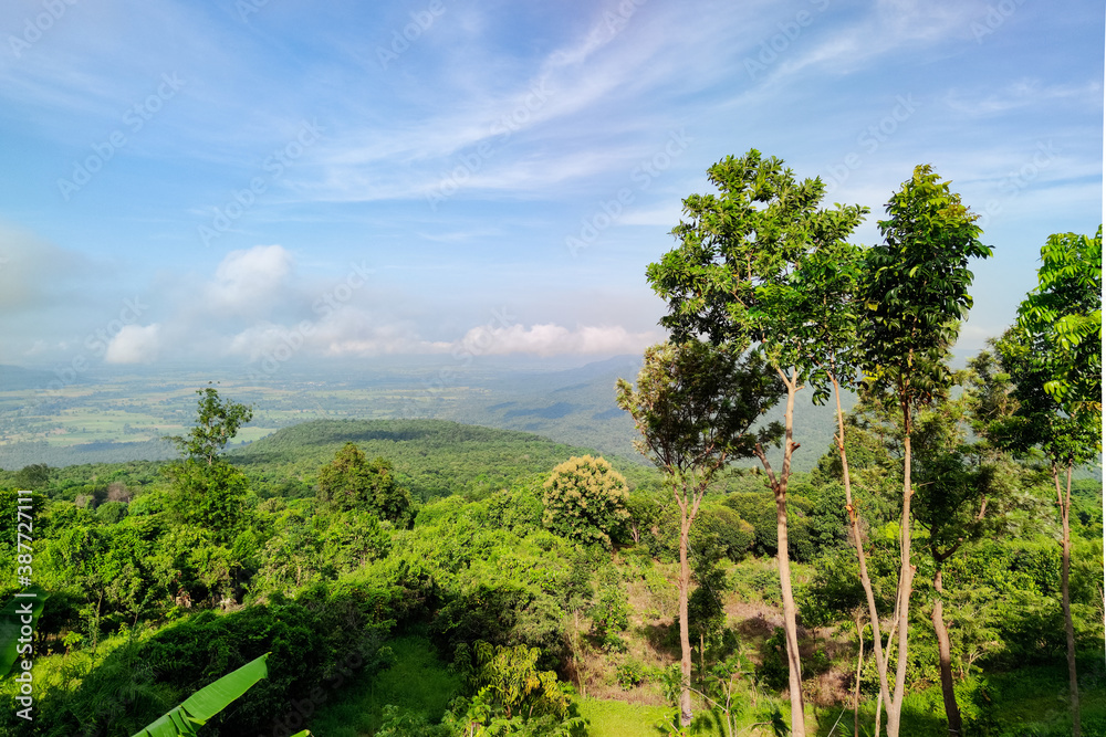 Landscape of forests, lush green mountains and beautiful skies.