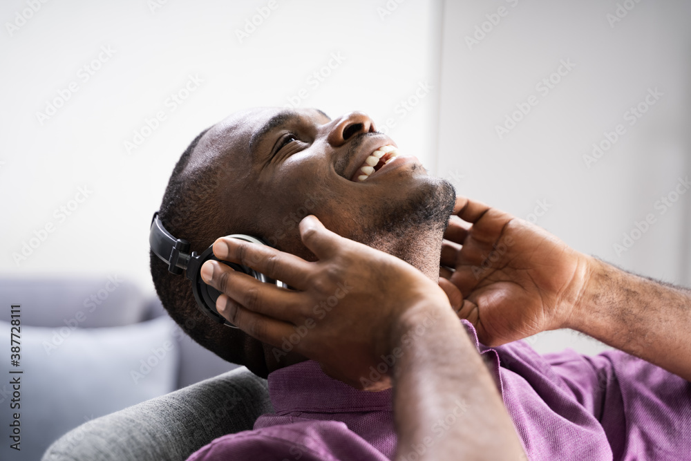 Naklejka premium Happy African American Man Enjoying Music