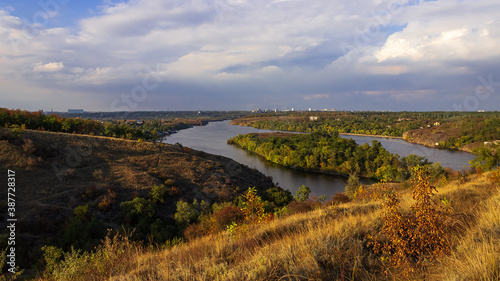 Картината върху платно Autumn landscape with river