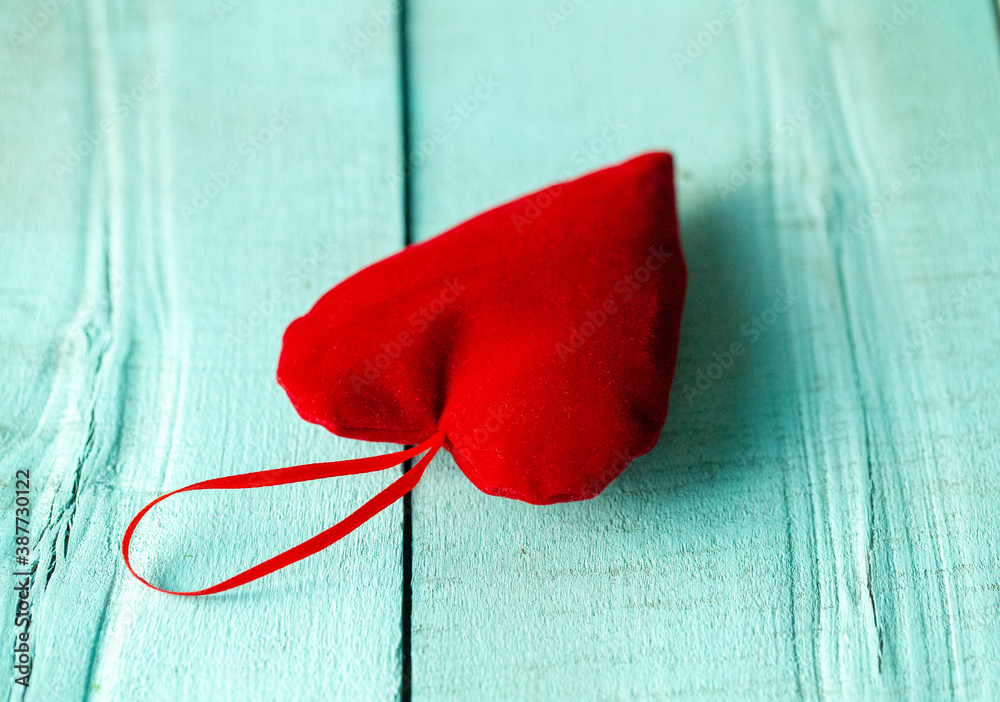 red velvet heart lying on a wooden turquoise surface, red heart red velvet heart lying on a wooden turquoise surface, red heart