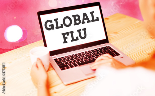 Word writing text Global Flu. Business photo showcasing Common communicable illness spreading over the worldwide fastly Modern gadgets with white display screen under colorful bokeh background photo