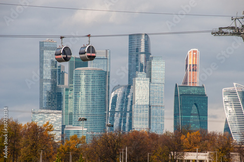 Cable car on the background of skyscrapers