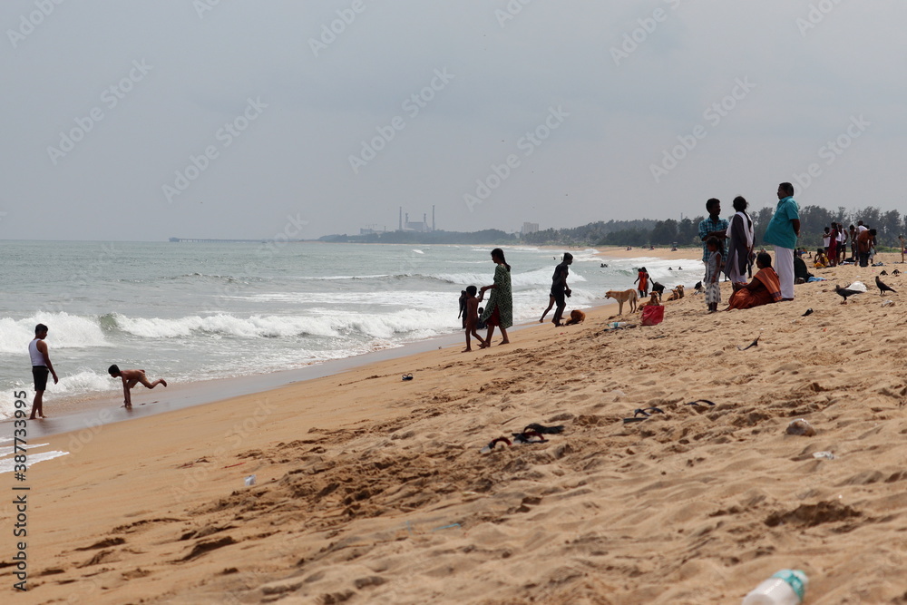 Crowds of people and tourists were seen around the seashore of Madras to get relief from the humidity and heat.