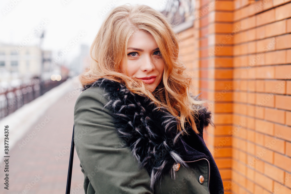 Pretty young woman walking on the city street. Casual fashion, plus size model. Pretty young woman walking on the city street. Casual fashion, plus size model.