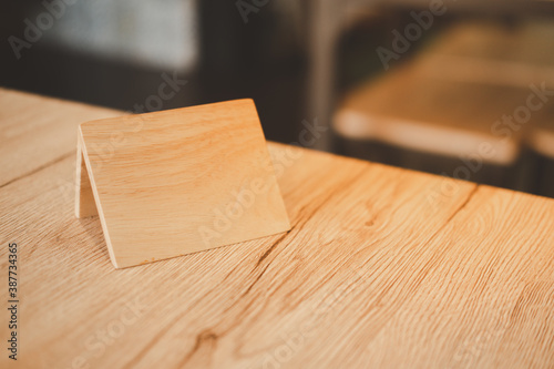 Empty wooden tag for reserved restaurant