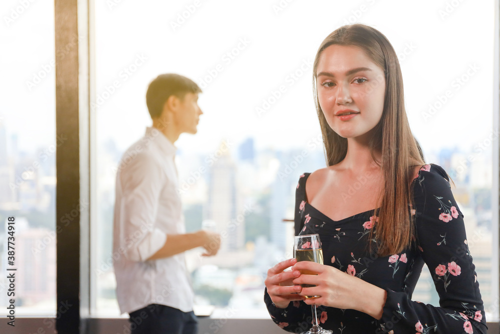 Young teen business people enjoy party celebration and talking with friends or coworker and relax drinking win or champagne on roof top building Young teen business people enjoy party celebration and talking with friends or coworker and relax drinking win or champagne on roof top building