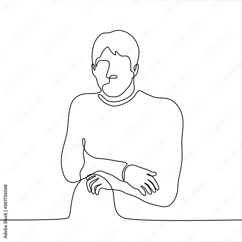 man is hunched over and sits stiffly with his arms and legs crossed ...