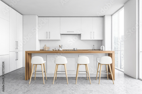 White kitchen interior with bar and stools © ImageFlow