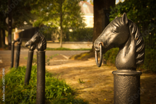 Antique hitching posts on Magazine Street in Uptown New Orleans, Louisiana