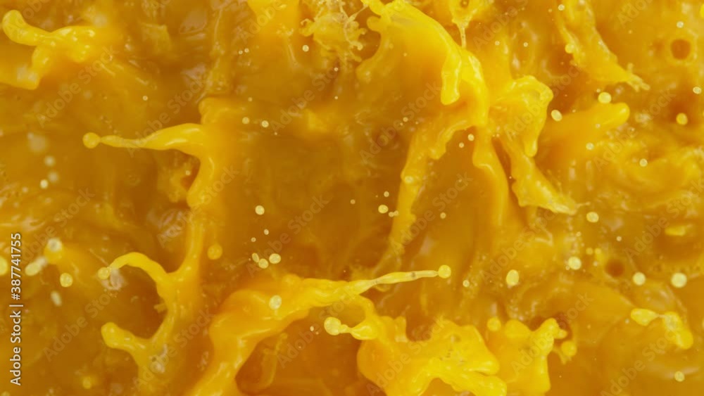 Super slow motion of splashing orange juice. Filmed on high speed cinema camera, 1000 fps. Super slow motion of splashing orange juice. Filmed on high speed cinema camera, 1000 fps.
