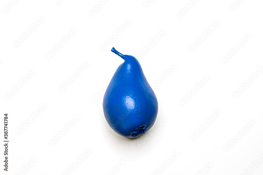 the big blue pear lies on a solid white background the big blue pear lies on a solid white background