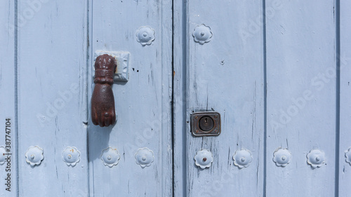 colored wooden doors with metal knobs