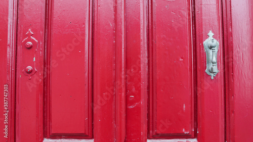 colored wooden doors with metal knobs