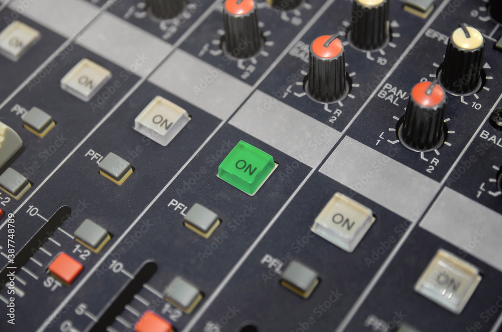 Audio mixer console and professional sound mixing with buttons and sliders. Audio mixer console and professional sound mixing with buttons and sliders.