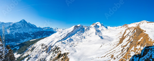 Wide panoramic view of winter landscape in Swiss Alps on the First mountain in Grindelwald, Switzerland