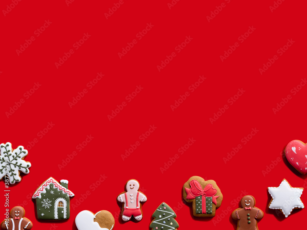 Red Xmas commercial background. Festive cookie pattern. Winter holidays party ornament. Different gingerbread biscuit collection minimal composition isolated on bright copy space.