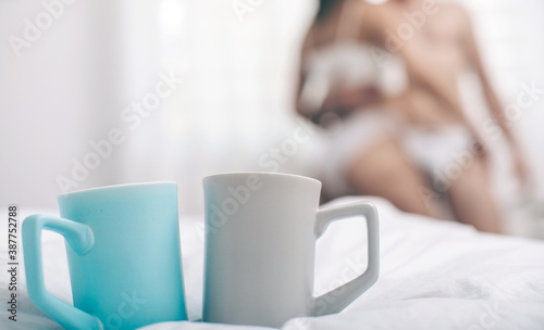 Cup of coffee on bed. Coffee cups. Bedroom. Bed. Good morning. Sensual. 