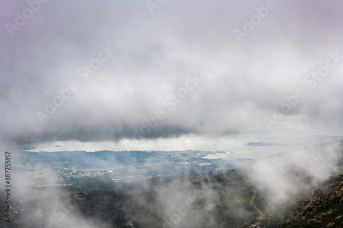 Aerial view of Rianxo on the Ria de Arousa estuary from the Muralla mountain on a foggy Summer afternoon.