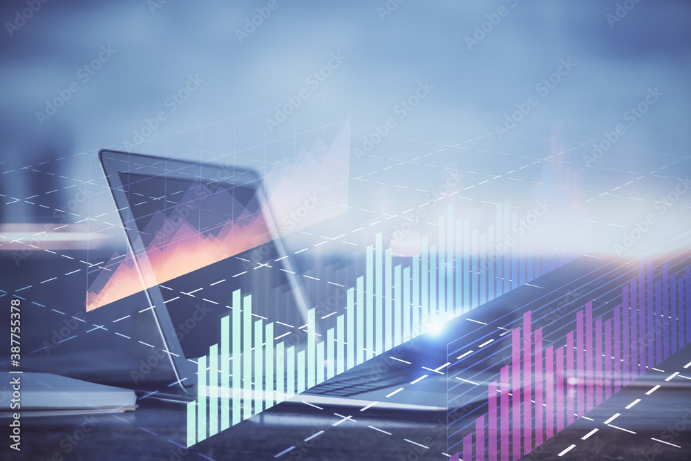 Stock market graph on background with desk and personal computer. Multi exposure. Concept of financial analysis.